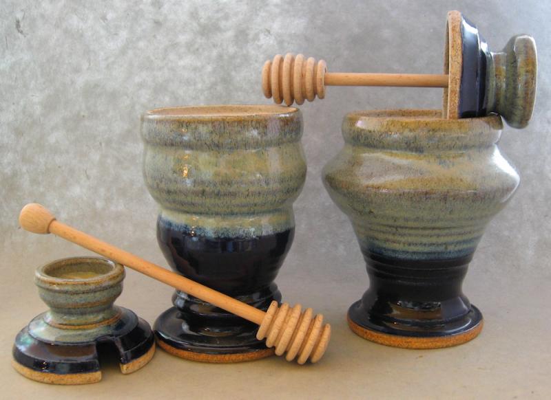 clay honey pots with wooden stick
